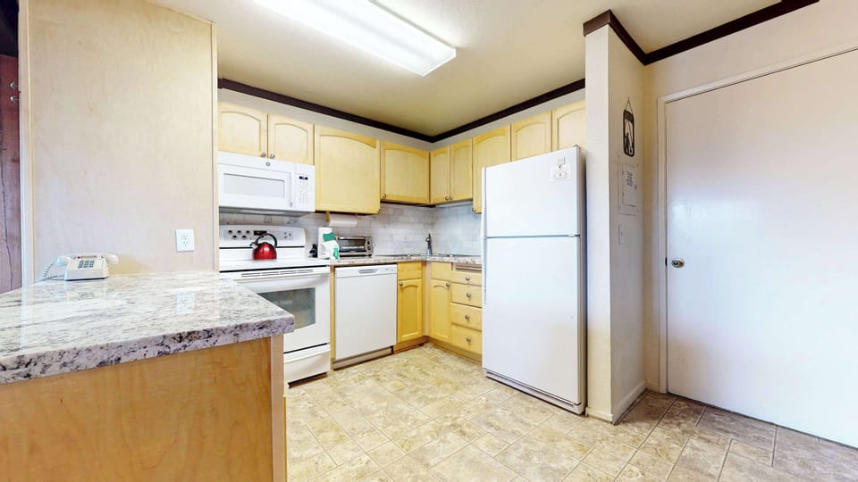 The inviting kitchen offers ample space & every home comfort
