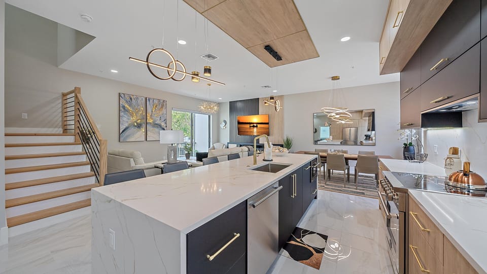 Create memorable meals in the stunning gourmet kitchen, featuring a massive waterfall island and state-of-the-art appliances.