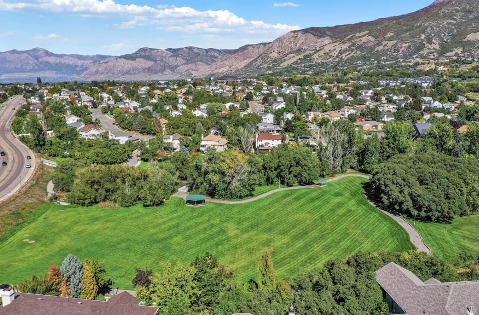 View of nearby park and stunning mountains.