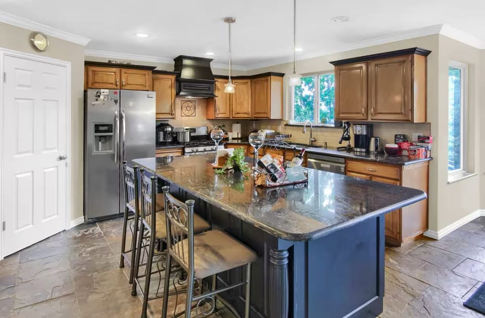 Natural tones in this open concept kitchen, stocked with everything you need.