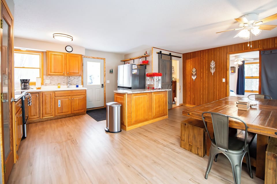 view of dining room, kitchen, bathroom and bedroom and end to the right