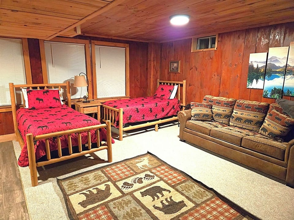Two twin beds, pull-out sofa bed and a television in the finished basement. Walk out to the hot tub.