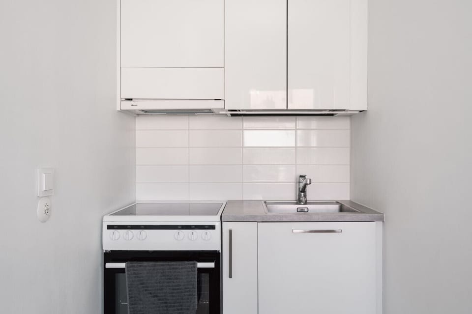 The kitchen is equipped with a modern oven and stovetop.