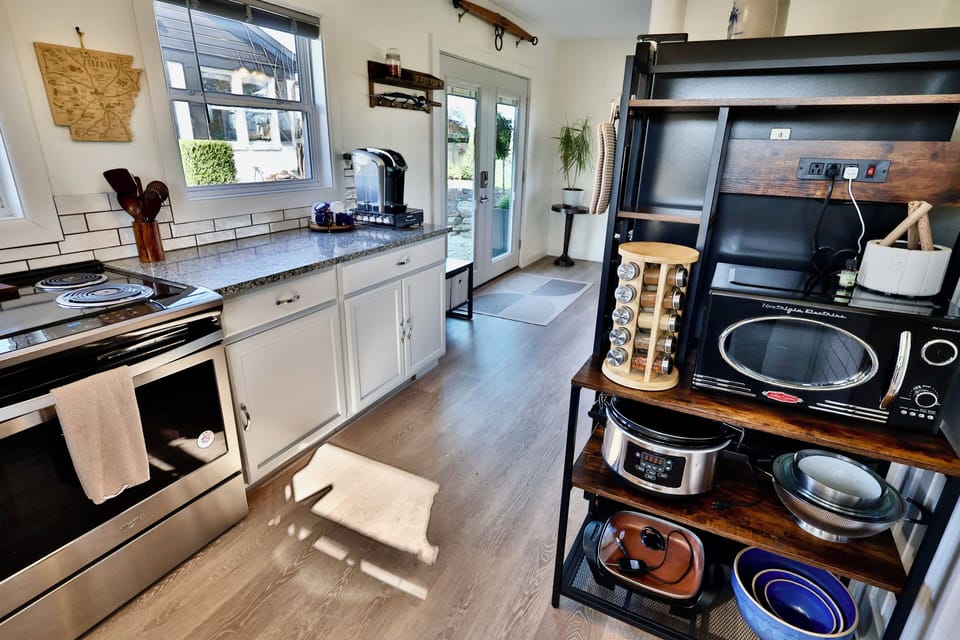 Full kitchen with spices and all cooking/baking supplies