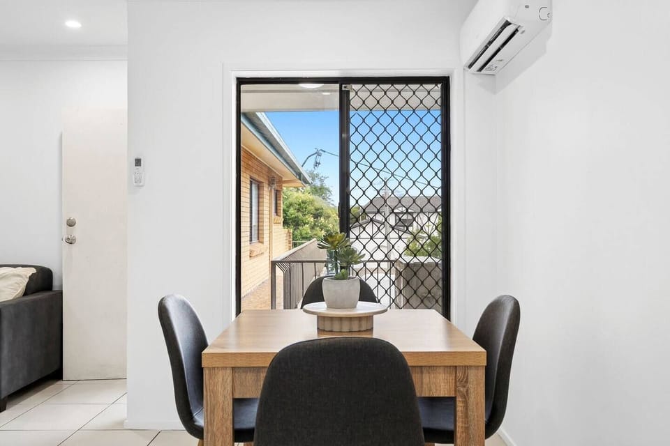 Enjoy a relaxed meal or morning coffee at the table for four with a leafy suburban outlook.