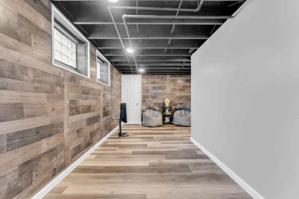 Cozy vibes in this basement retreat!  Perfect for movie nights and chill sessions.  #basementgoals