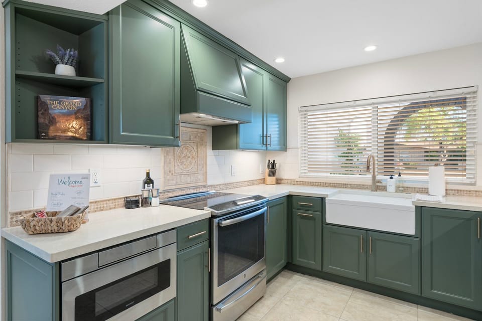 Kitchen with stainless steel applicances, microwave, and oven