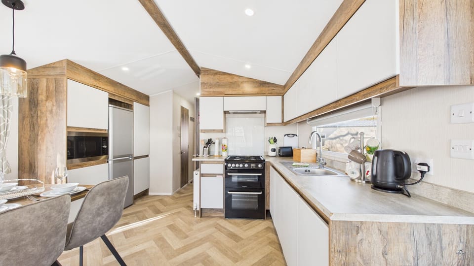 Open-plan kitchen with kettle and toaster.