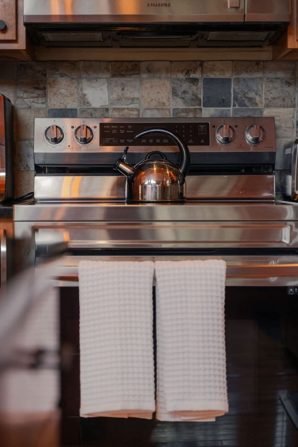 Kitchen: Cook up a storm in this modern, fully-equipped kitchen with sleek appliances!