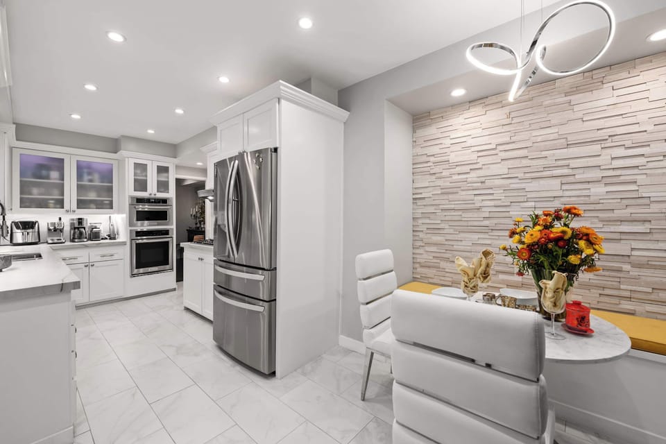A stunning kitchen fully equipped for cooking gourmet meals or brewing your morning coffee—complete with a cozy breakfast nook for catching up on the day’s news.