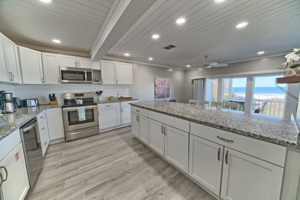 This dreamy kitchen blends ocean views, modern style, and tons of counter space.