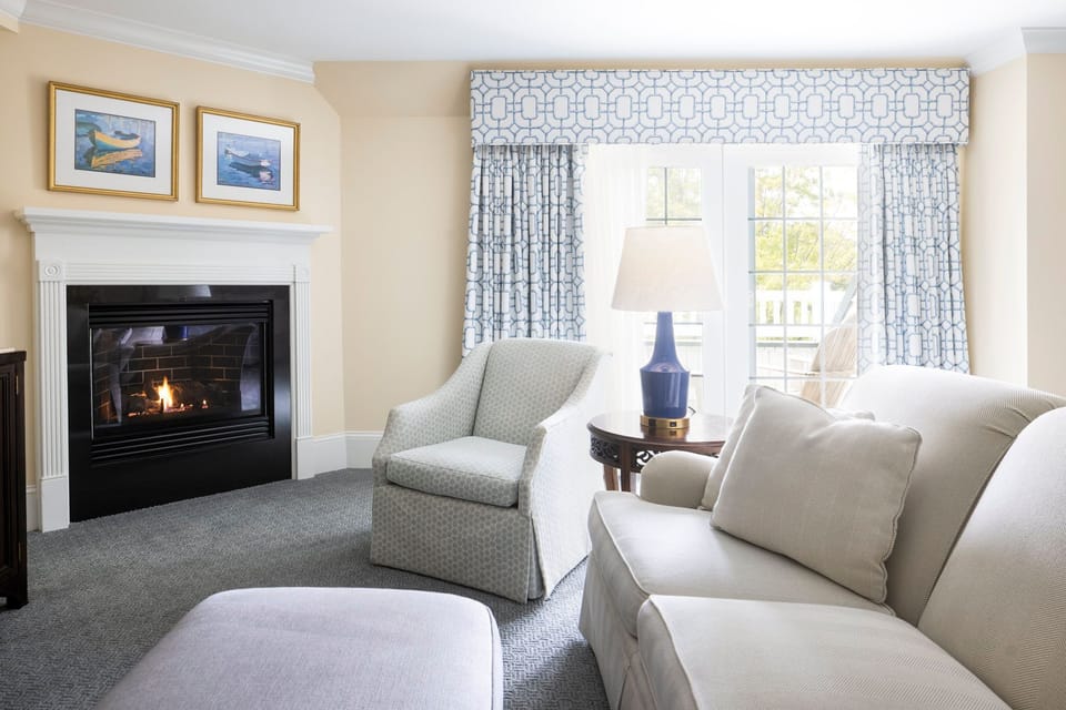 A cozy fireplace and sunlit seating create the perfect space to relax and unwind.