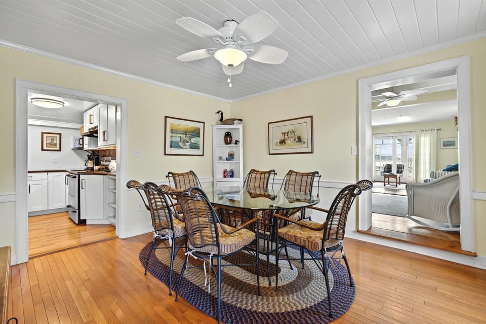 Elegant dining room with seating for six, ideal for home-cooked meals or game nights.