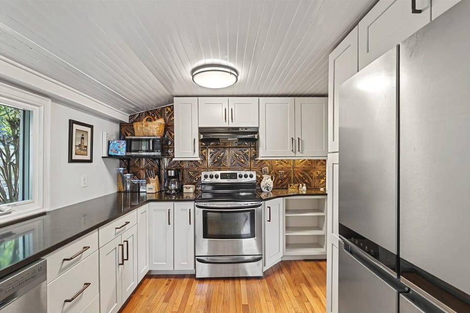 Spacious and modern kitchen layout, ideal for cooking up riverside feasts.