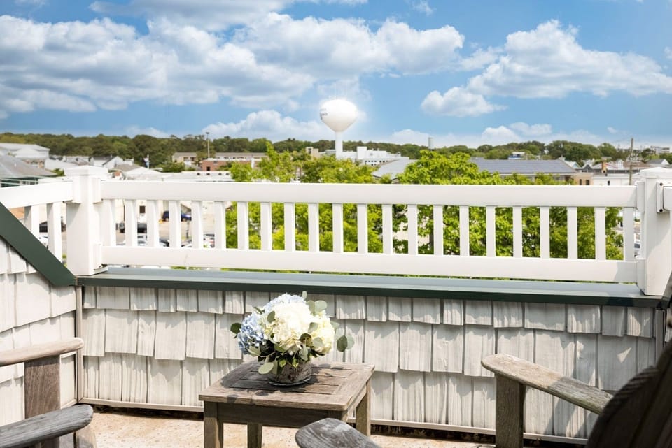 Breathtaking rooftop views and cozy seating make this private balcony the perfect place to relax.
