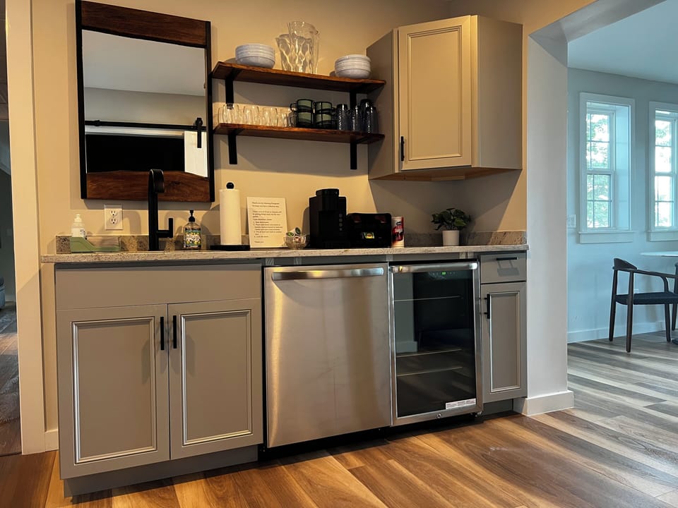 lower coffee bar, mini fridge and dishwasher