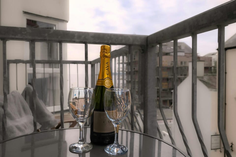 Outdoor eating area with champagne and glasses