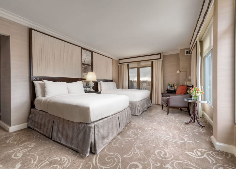 Elegant and spacious retreat, where plush bedding, soft lighting, and refined décor create the perfect stay.