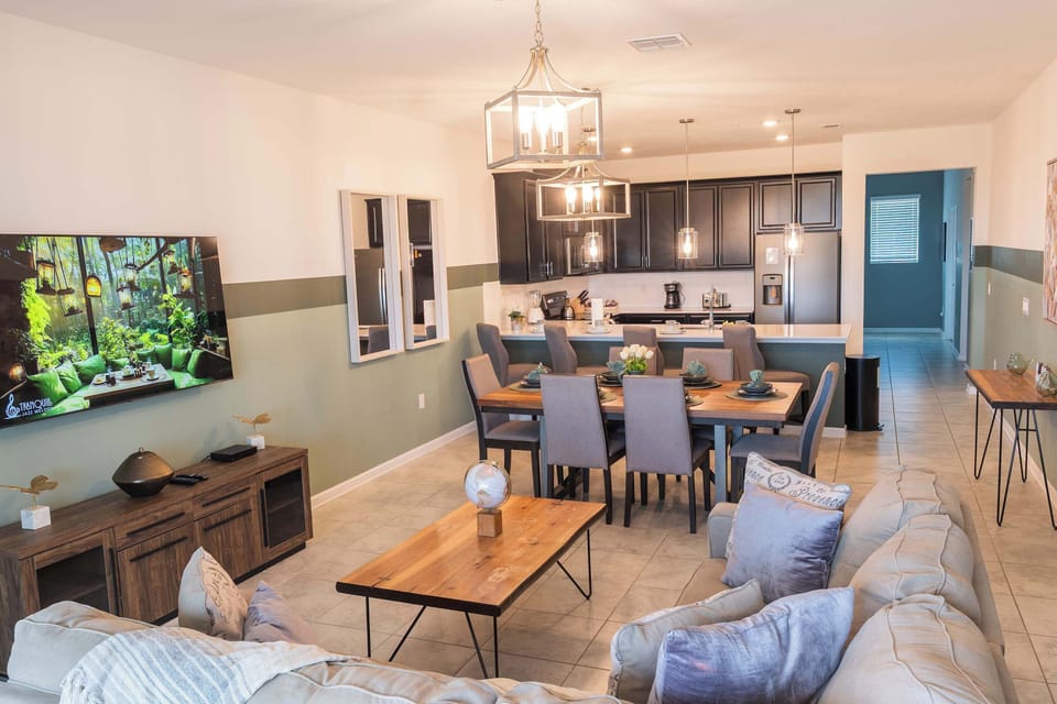 Elegant dining room with seating for the whole family — enjoy home-cooked meals after Disney days