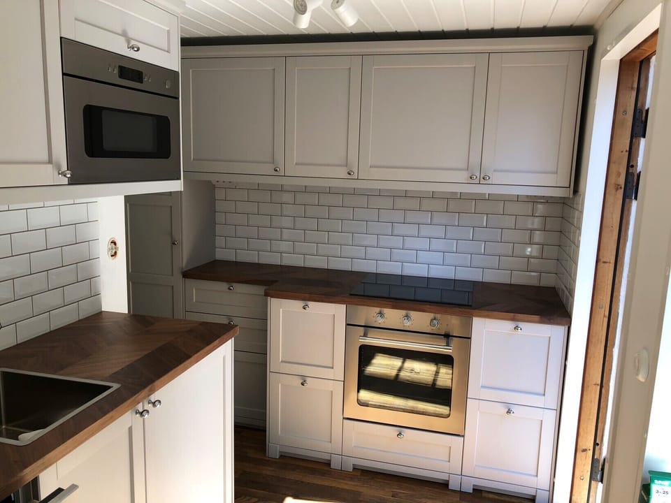 Newly renovated kitchen with dishwasher, microwave, oven, induction stove. Fully equipped. 