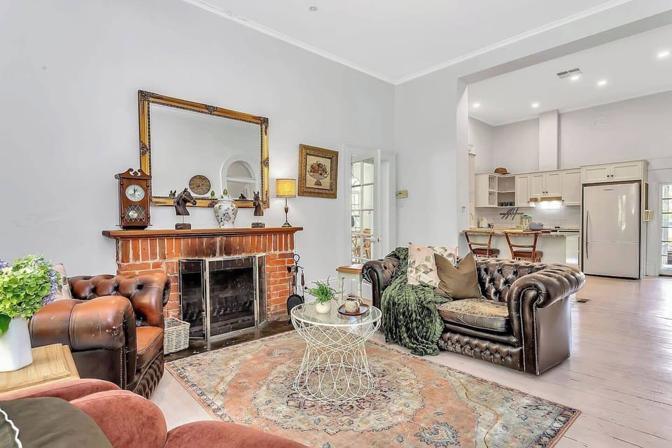 Unwind in the warmth of this character-rich lounge, where leather Chesterfields, a red-brick fireplace, and vintage details invite evening chats and relaxed downtime.
