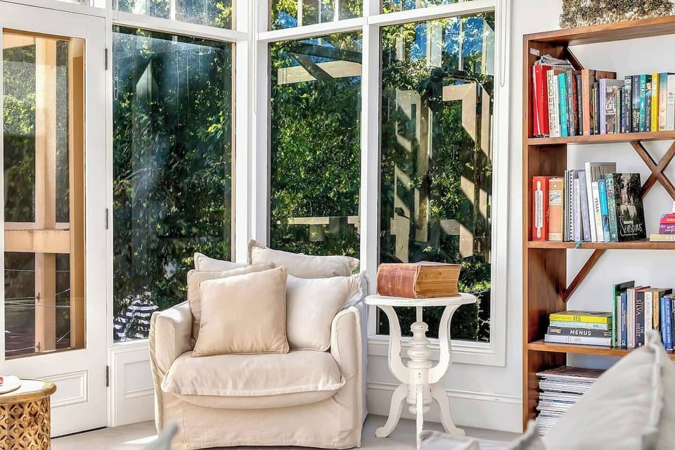 For those who love to unwind with a good book, the light-filled reading corner offers the perfect spot in the armchair beside full-height windows.