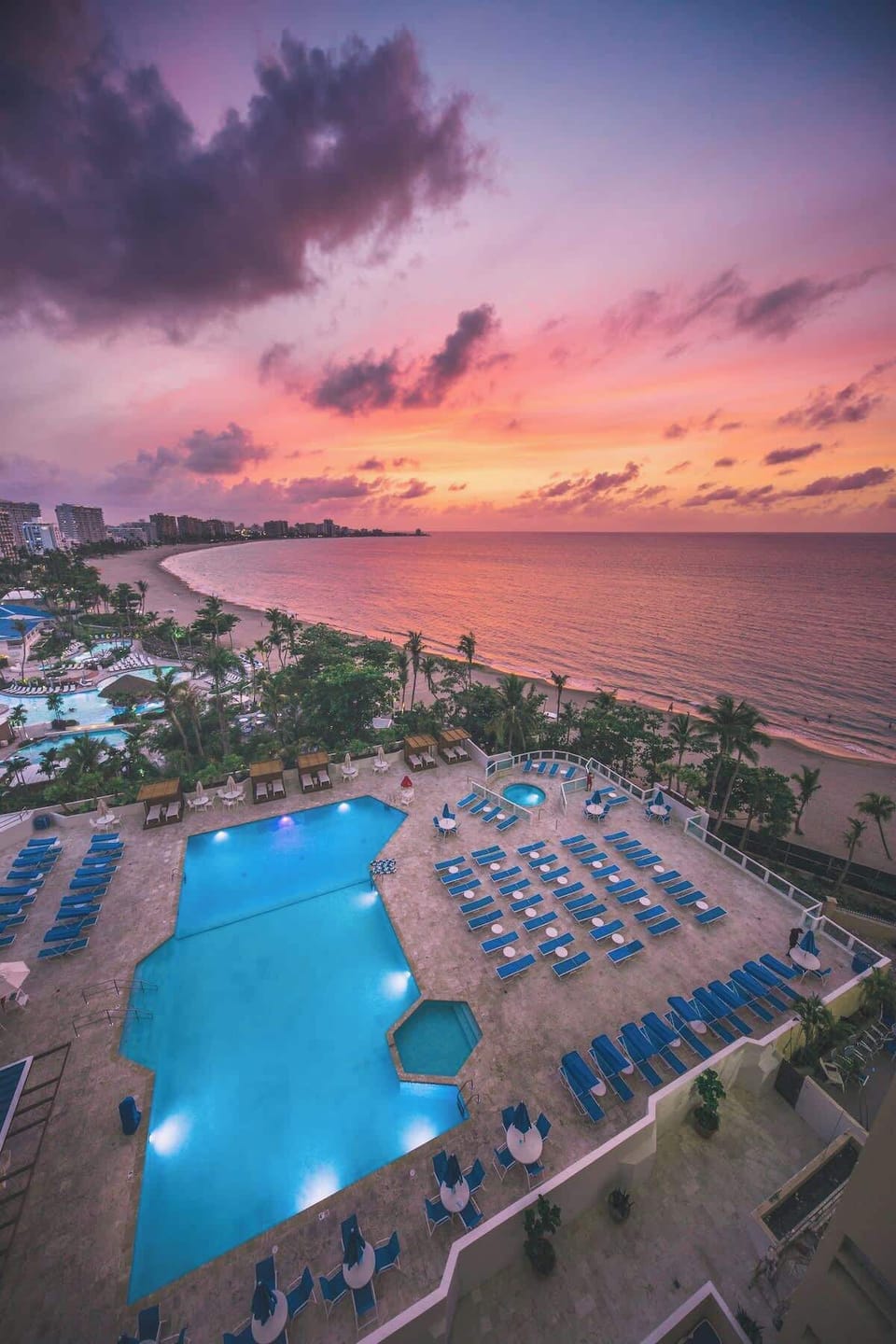 Not the view from the balcony. Photo of the pool and beach location. The property is right on the beach and the sunsets are visible from the pool. 