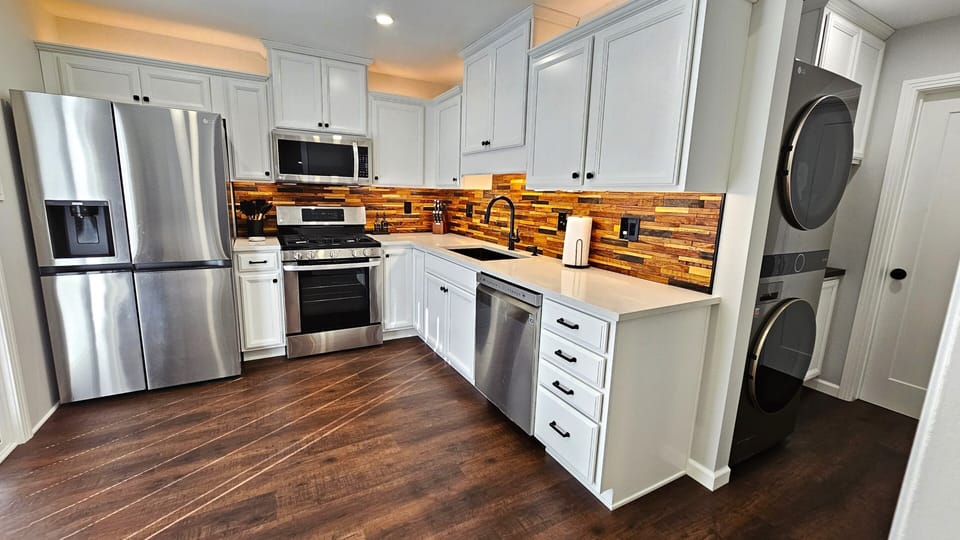 Fully stocked with necessary cookware. Indoor laundry with detergent.