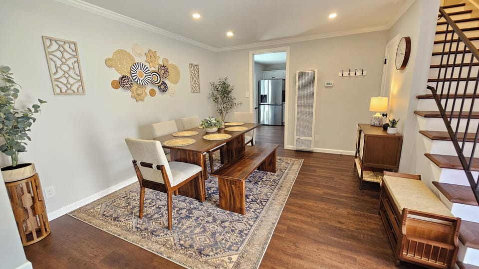 Modern Boho styled dining area with shoe rack and complimentary board games.