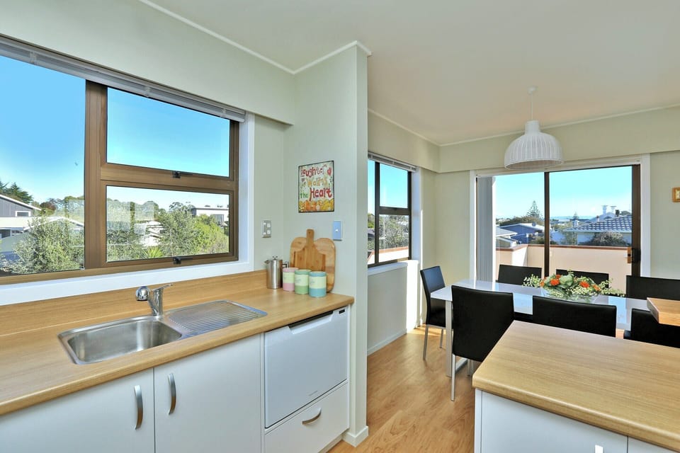Kitchen to the dining area. Convenient dishwasher drawer for easy clean up.