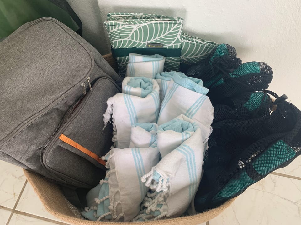 Beach supplies, towels, snorkels. cooler, chairs, yoga mats, umbrella