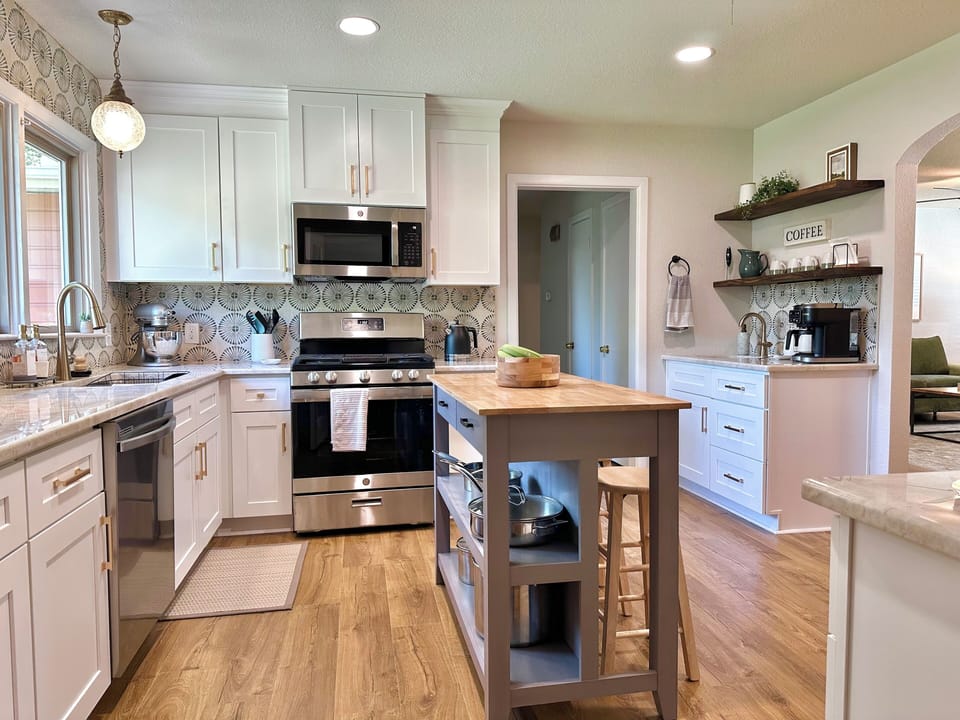 Kitchen with eat-in island and coffee bar.