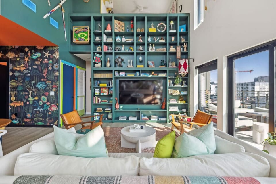 World of whimsy at Pie Town Emporium- Open concept living/dining/kitchen spaces. Enjoy extra sleeping space on the sofa bed.