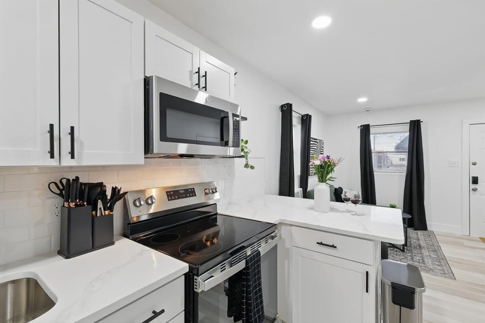 “Sleek & Functional Kitchen Setup”
Whip up your favorite meals with modern appliances, a full knife set, and ample counter space — all in a clean, stylish design.