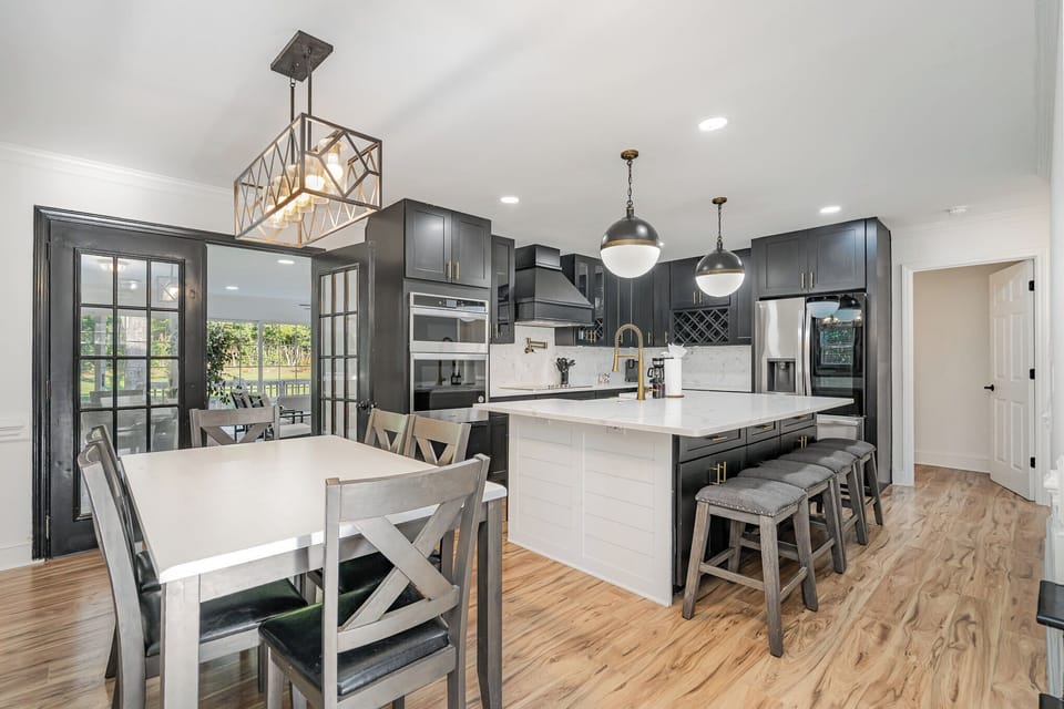 The spacious kitchen sits at the center of the home and gives guests the perfect spot to entertain and cook a meal from