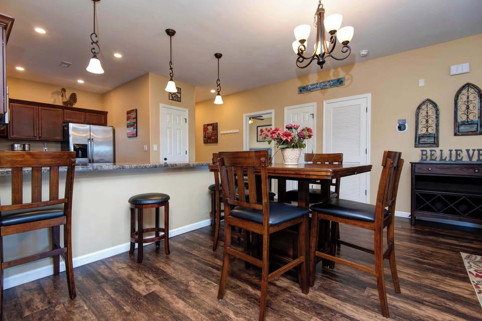 Dining room table expands to comfortably seat up to six people—perfect for family meals or entertaining guests with an additional two bar stools at the breakfast bar for extra seating and casual dining