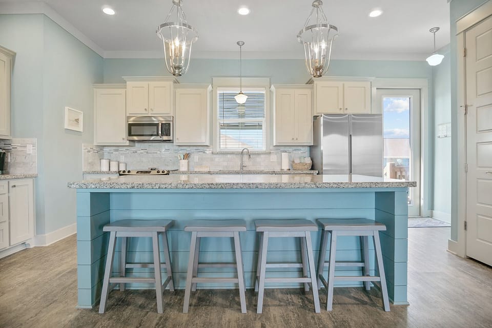 Touches of the sea meet simple comfort in every room.
