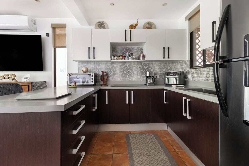 Enjoy preparing meals in the large kitchen, equipped with a full-size fridge, countertop oven and air fryer.