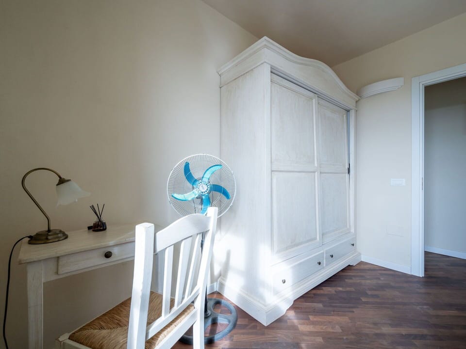 Furniture, Wood, Interior Design, Flooring, Kitchen, Cabinetry, Floor, Room, Major Appliance, Cupboard