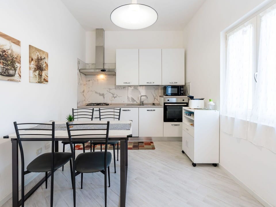Furniture, Wood, Interior Design, Flooring, Kitchen, Cabinetry, Floor, Room, Major Appliance, Cupboard