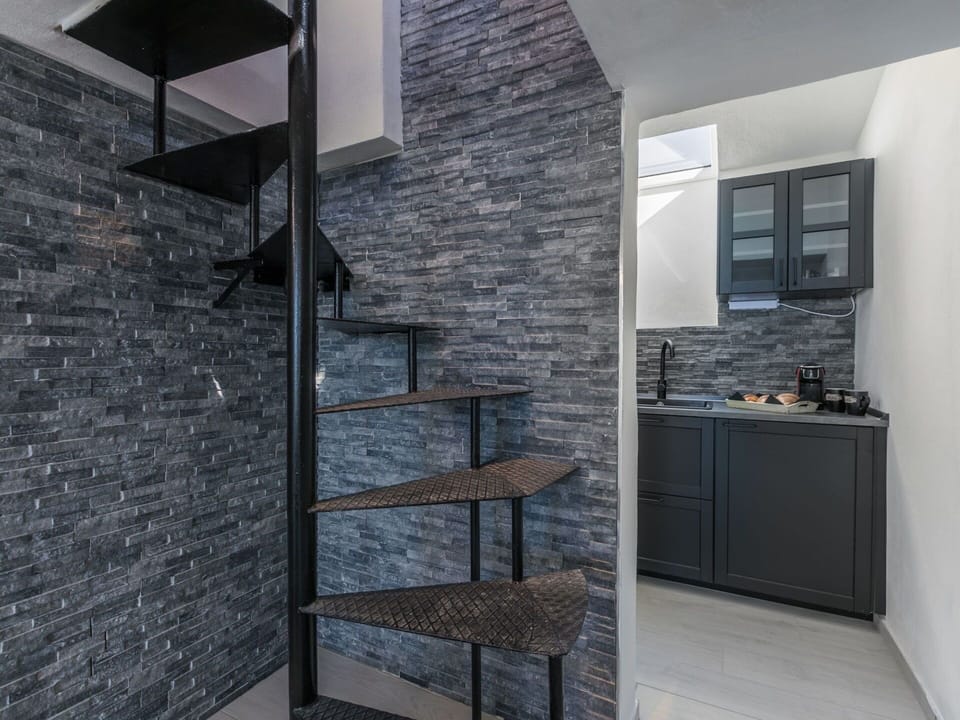 Furniture, Wood, Interior Design, Flooring, Kitchen, Cabinetry, Floor, Room, Major Appliance, Cupboard