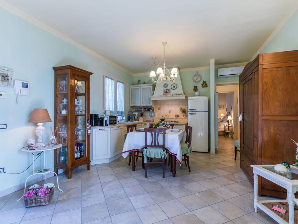 Furniture, Wood, Interior Design, Flooring, Kitchen, Cabinetry, Floor, Room, Major Appliance, Cupboard