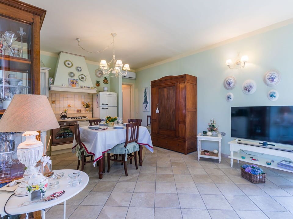 Furniture, Wood, Interior Design, Flooring, Kitchen, Cabinetry, Floor, Room, Major Appliance, Cupboard