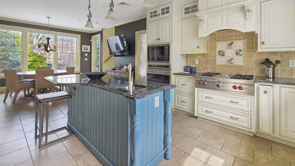 Kitchen with high-end appliances and center island with counter seating