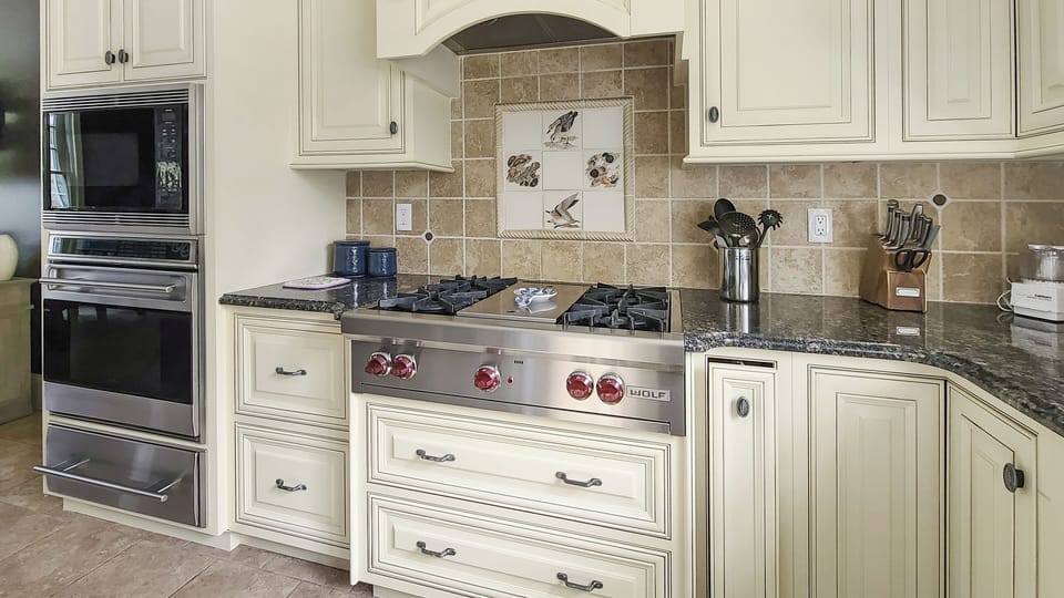 Kitchen with high-end appliances and center island with counter seating