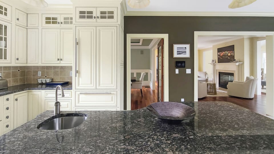 Kitchen with high-end appliances and center island with counter seating