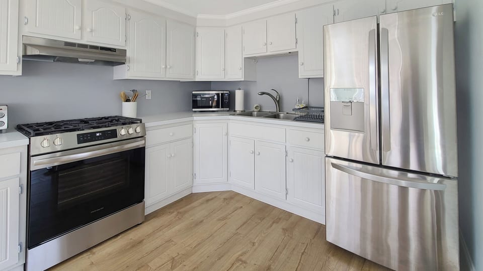 Nicely equipped kitchen with stainless appliances
