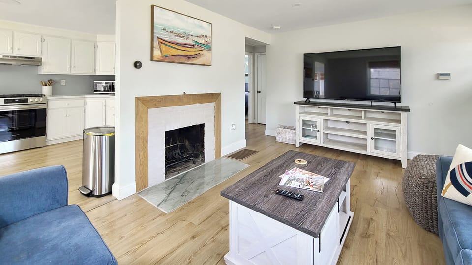 Living room with comfortable seating and flat screen TV