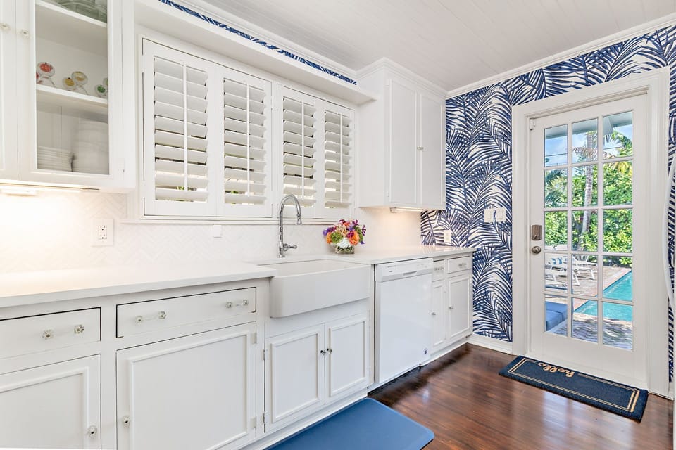 Cook with perfection with entrance onto the pool deck. Brand new applicances & gas range stove. A kitchen fit for a masterchef!