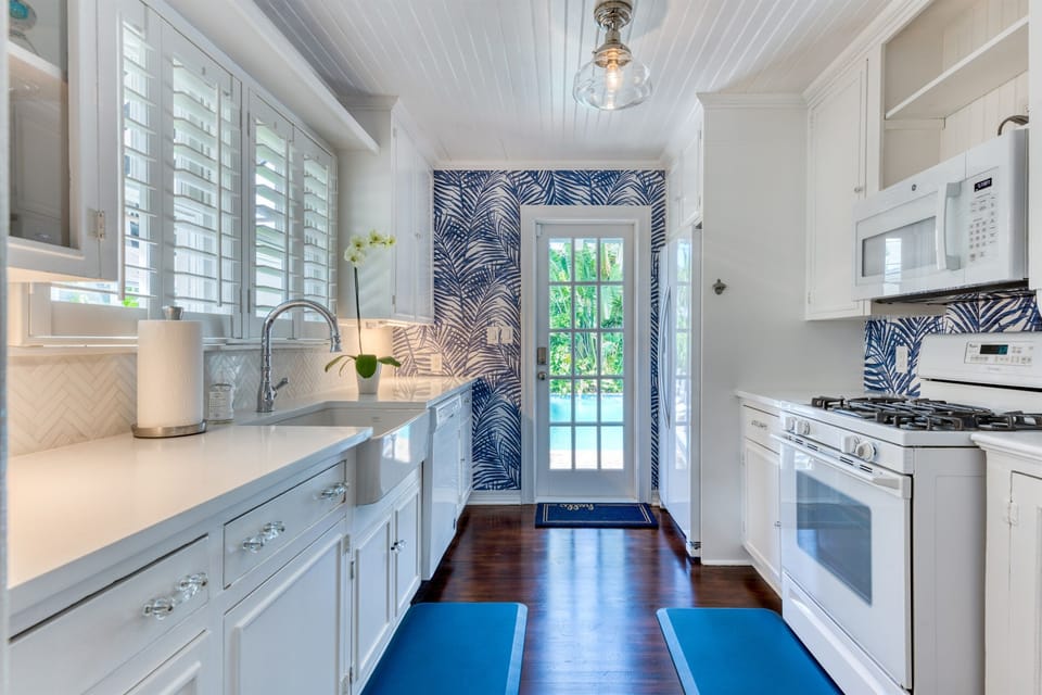 Cook with perfection with entrance onto the pool deck. Brand new applicances & gas range stove. A kitchen fit for a masterchef!